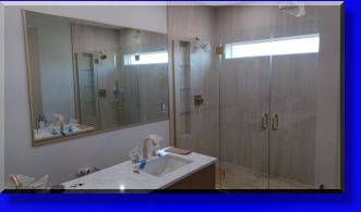 We Provided the Glass Shelves within the Shower Plus Installed the Master Vanity Mirror with Two Electrical Outlets and Mirror Trim